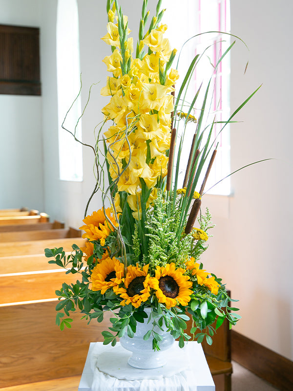 White Designer Urn with yellow flowers